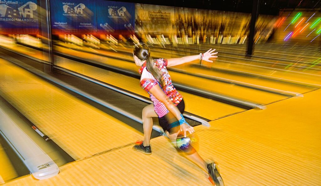girl playing bowling